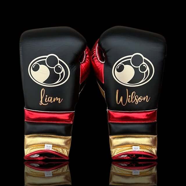 Grant Boxing Gloves in Black/Red/Gold colorway - Professional Lace-Up training gloves