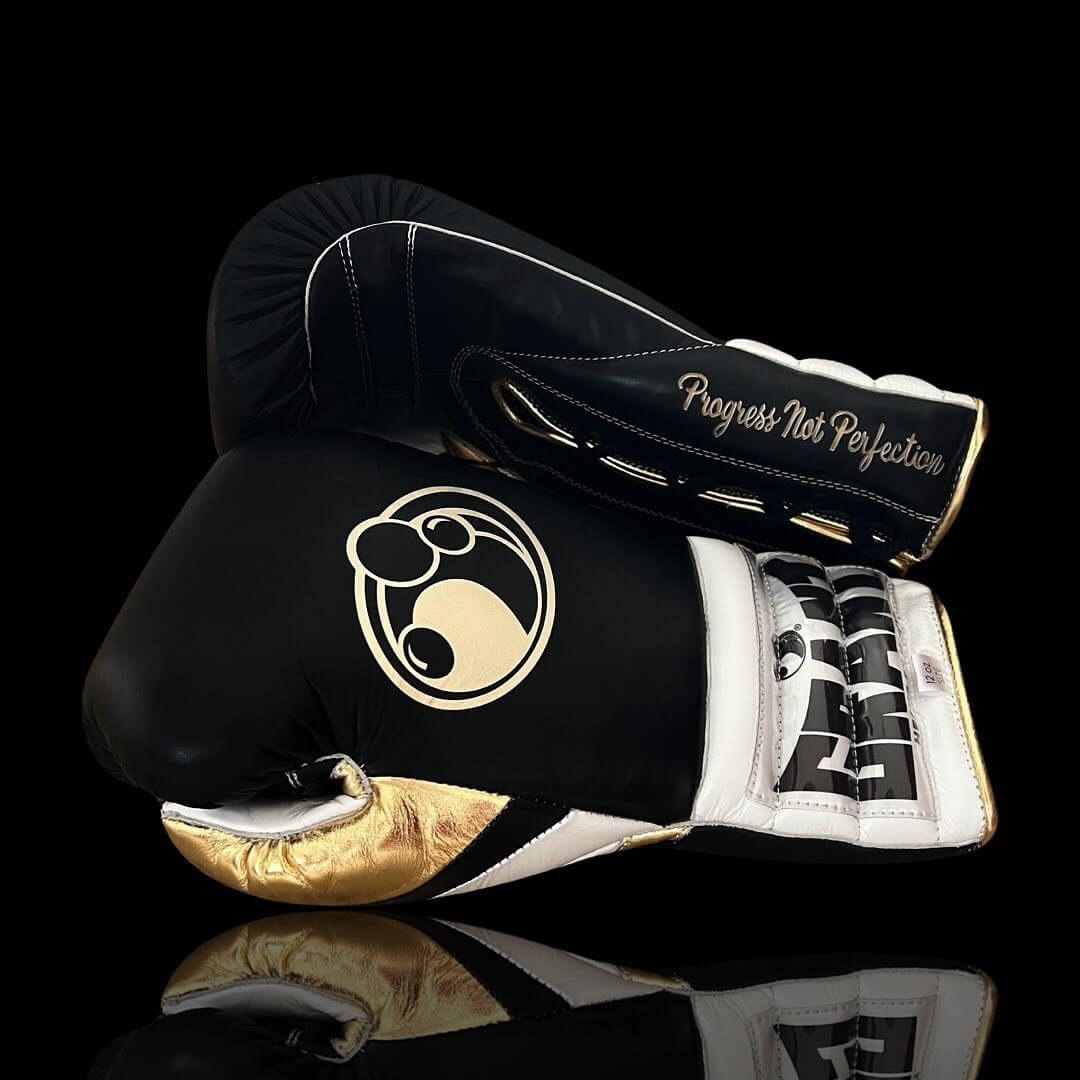 Grant Boxing Gloves in Black/White/Gold colorway - Professional Lace-Up training gloves