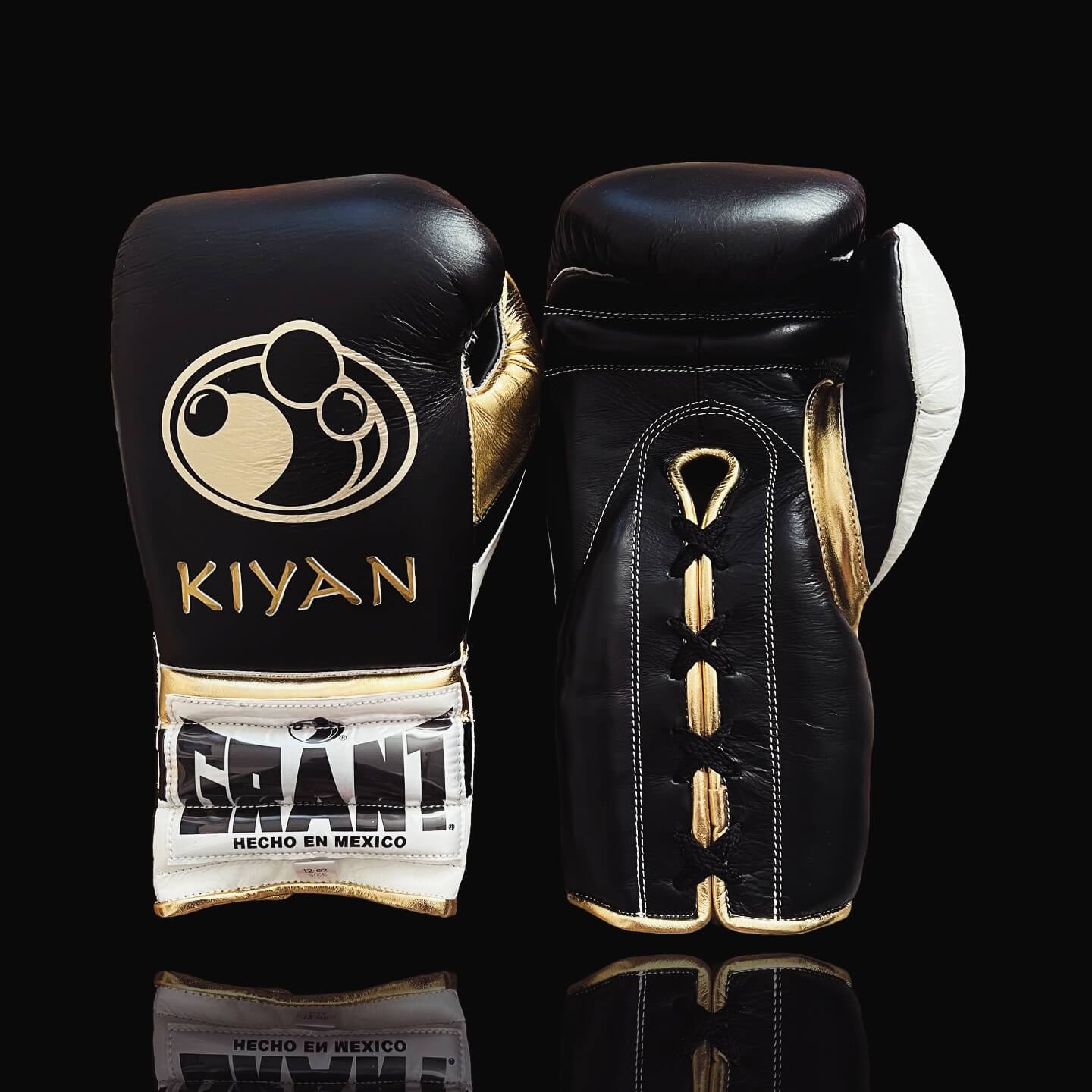 Grant Boxing Gloves in Black/Gold/White colorway - Professional Lace-Up training gloves