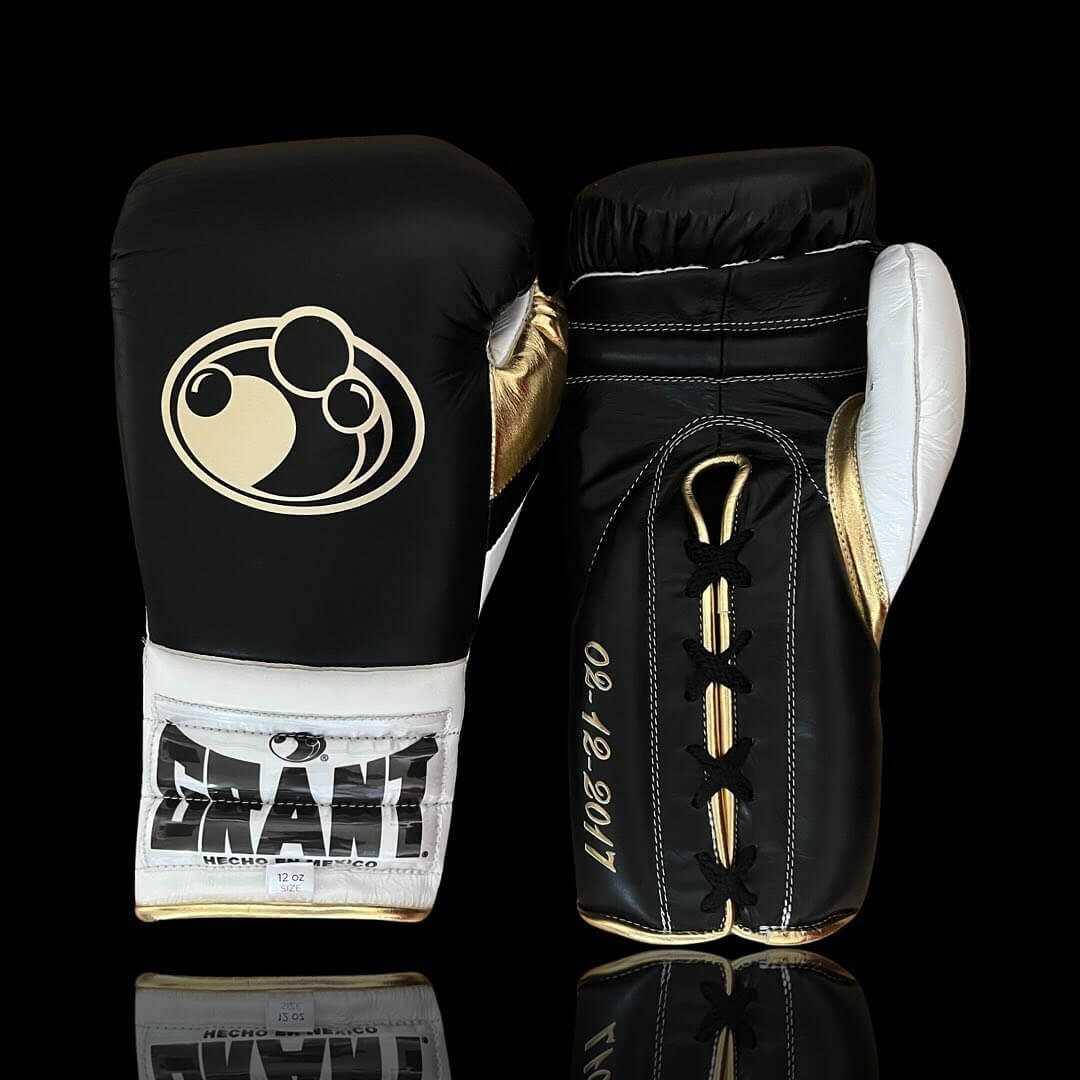 Grant Boxing Gloves in Black/White/Gold colorway - Professional Lace-Up training gloves