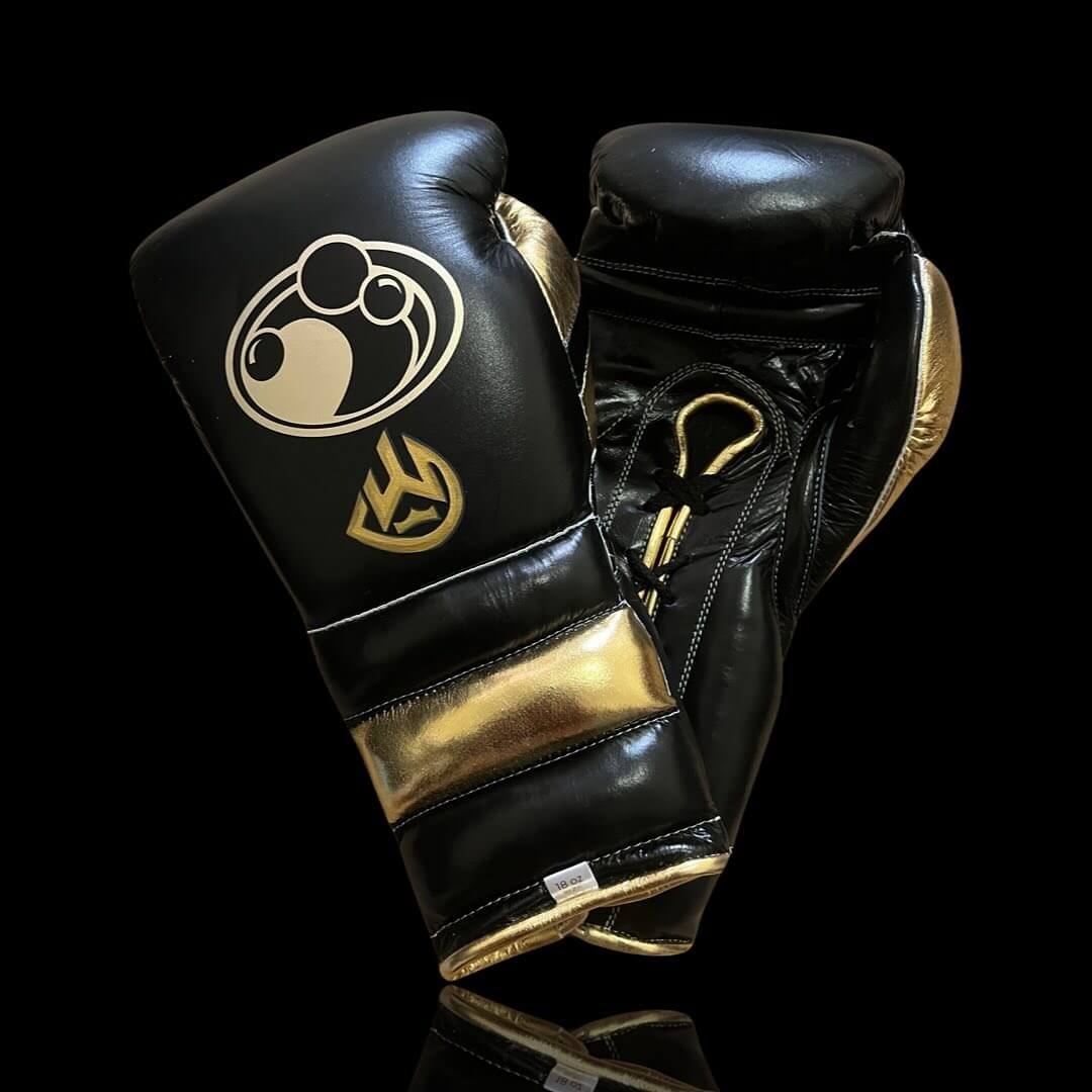 Grant Boxing Gloves in Black/Gold colorway - Professional Lace-Up training gloves