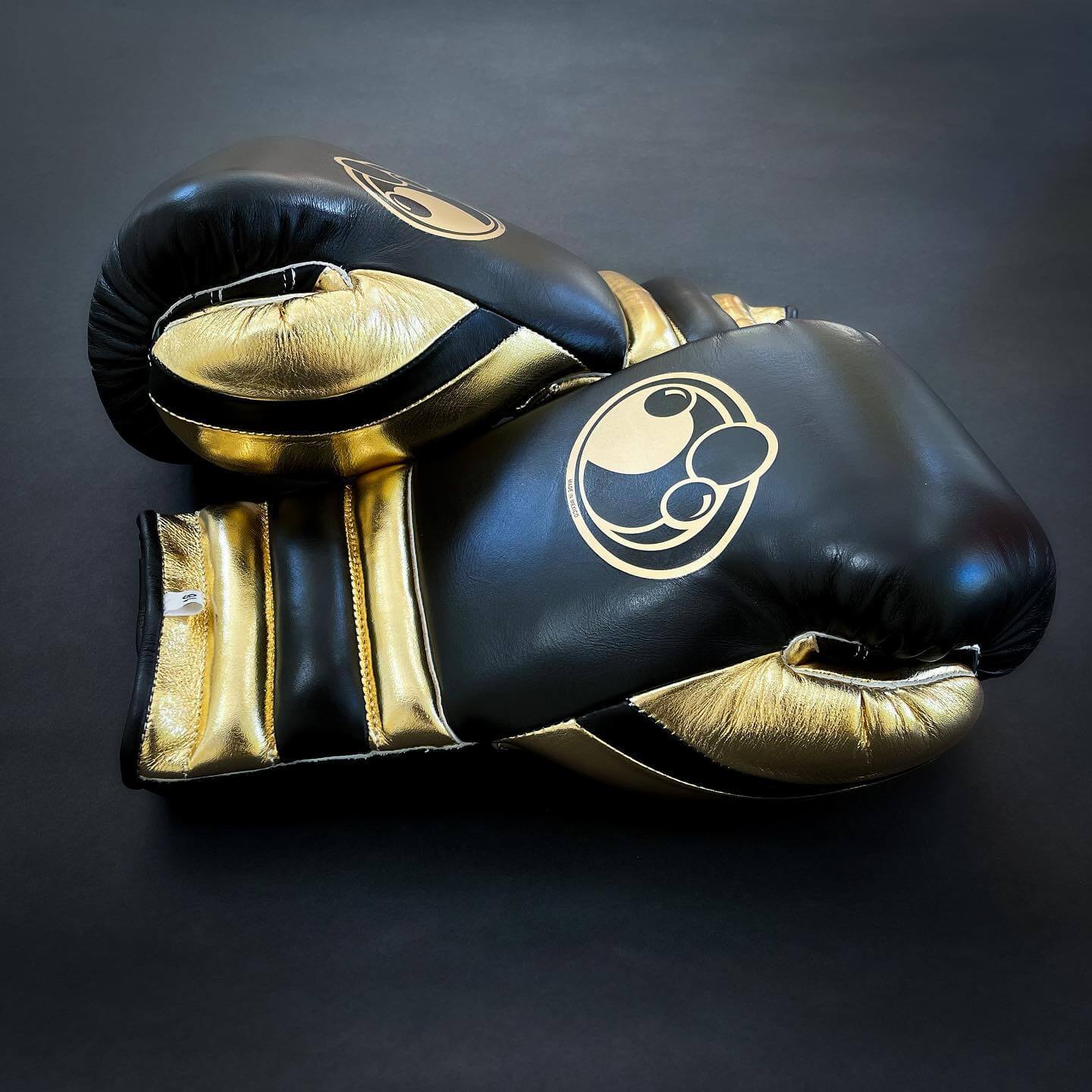Grant Boxing Gloves in Black/Gold colorway - Professional Lace-Up training gloves