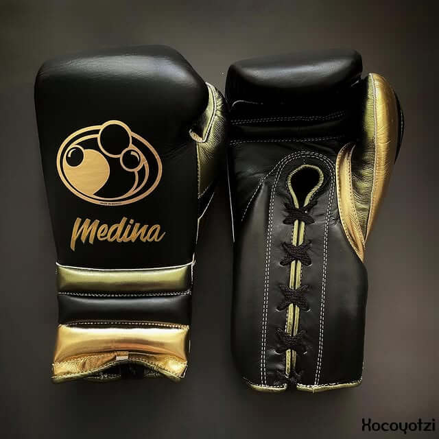 Grant Boxing Gloves in Black/Green/Gold colorway - Professional Lace-Up training gloves