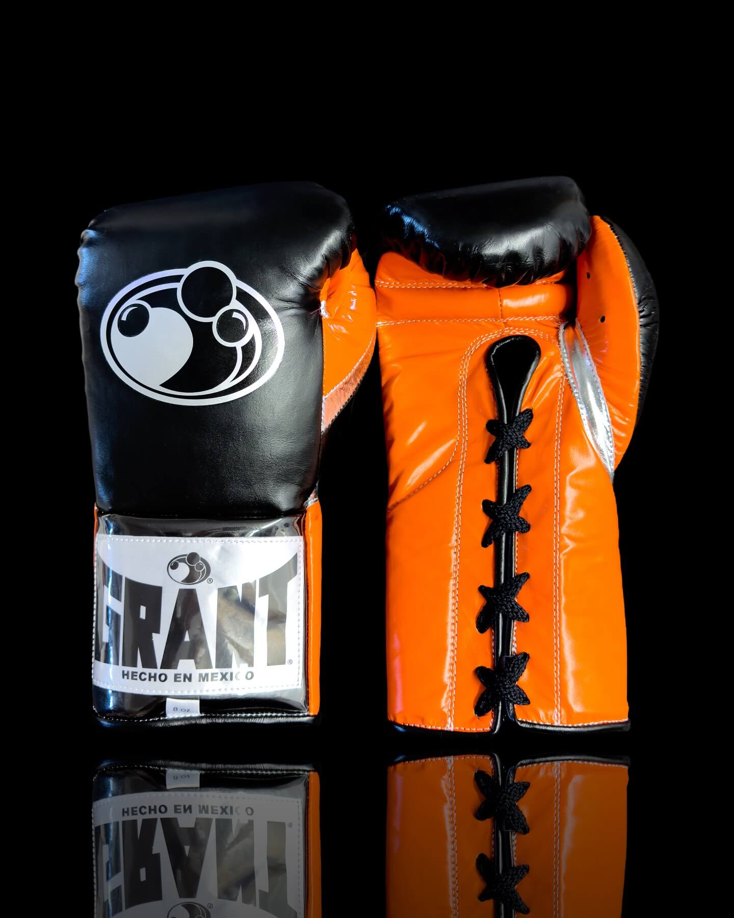Grant Boxing Gloves in Black/Orange/Silver colorway - Professional Lace-Up training gloves