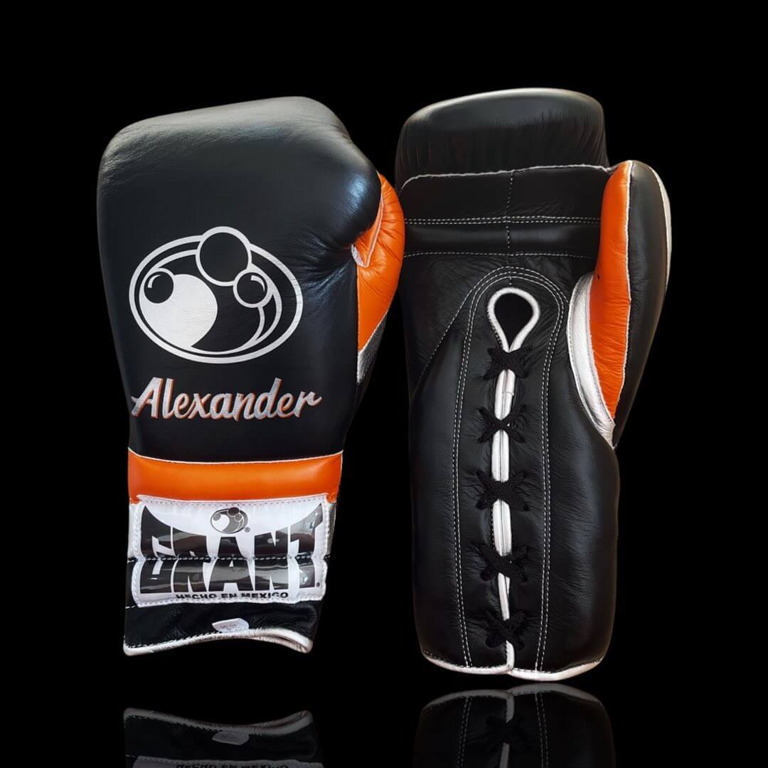 Grant Boxing Gloves in Black/Orange/White colorway - Professional Lace-Up training gloves