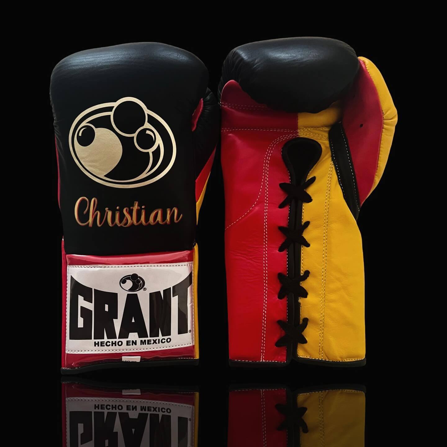 Grant Boxing Gloves in Black/Red/Yellow colorway - Professional Lace-Up training gloves