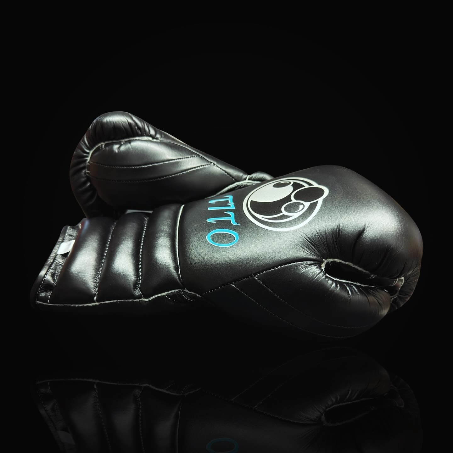Grant Boxing Gloves in Black/Blue colorway - Professional Lace-Up training gloves