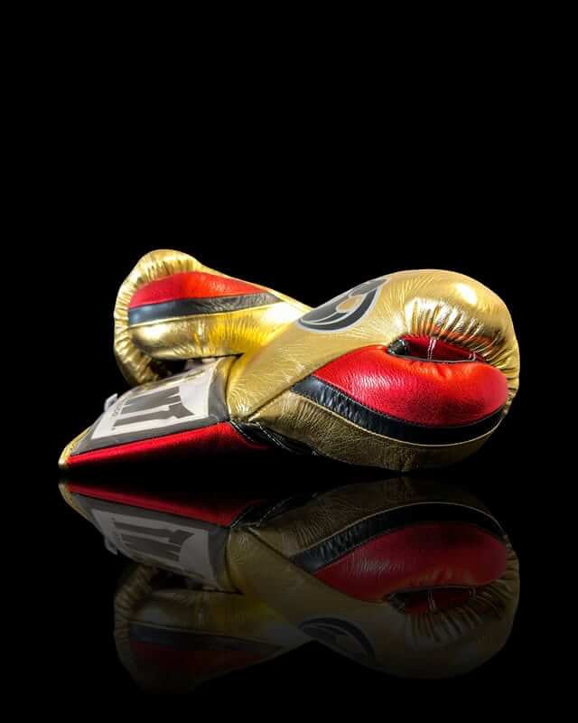 Grant Boxing Gloves in Gold/Red/Blue colorway - Professional Lace-Up training gloves