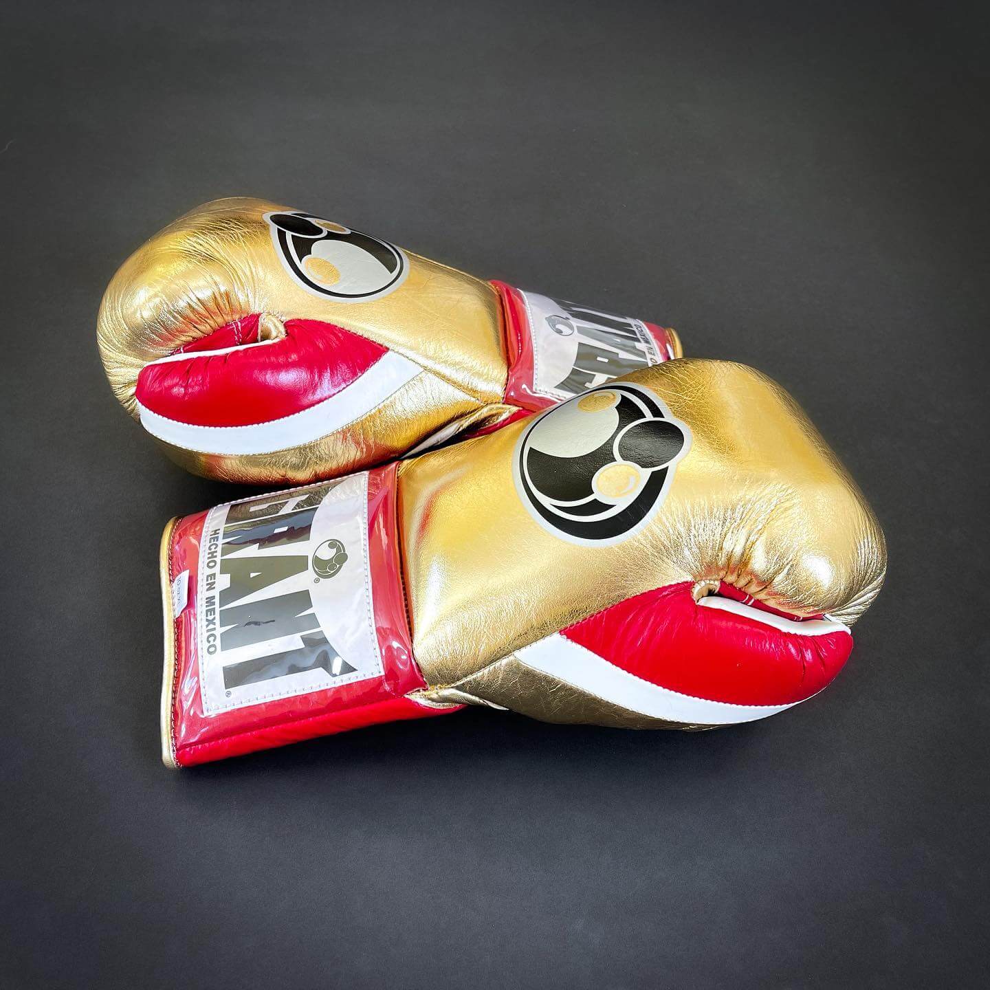 Grant Boxing Gloves in Gold/Red/White colorway - Professional Lace-Up training gloves
