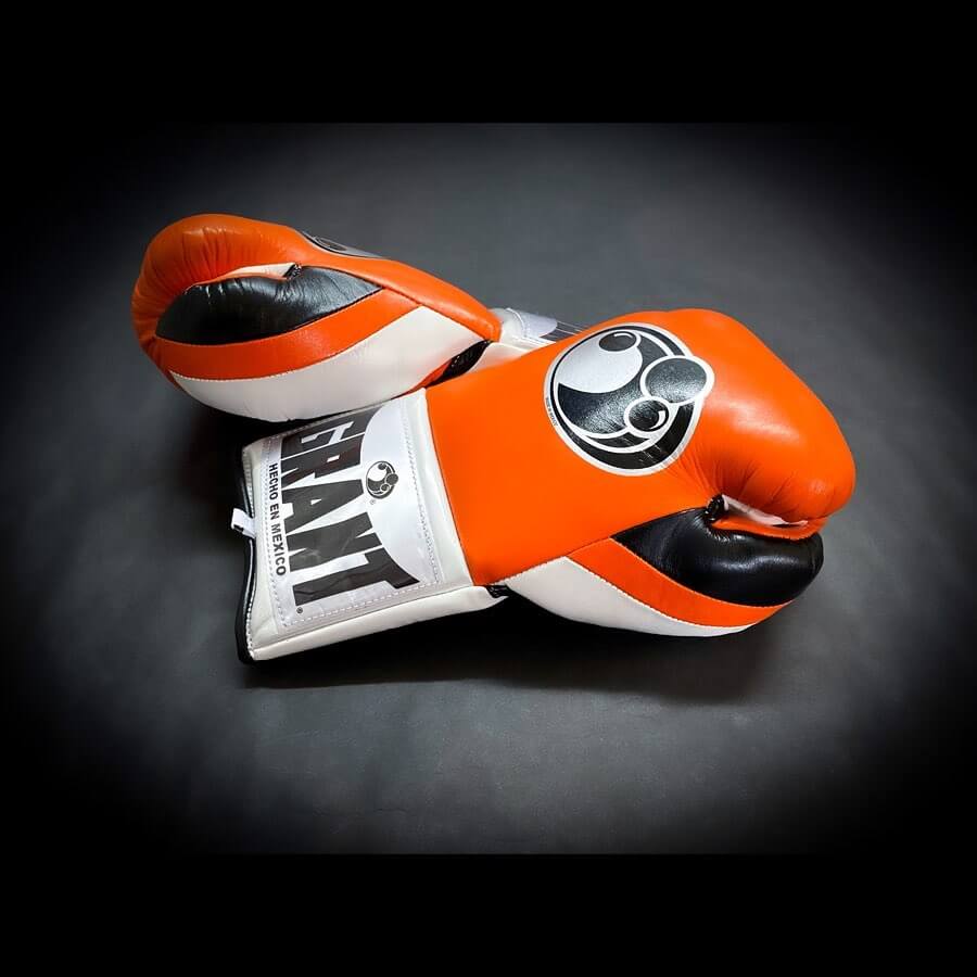 Grant Boxing Gloves in Orange/White/Black colorway - Professional Lace-Up training gloves