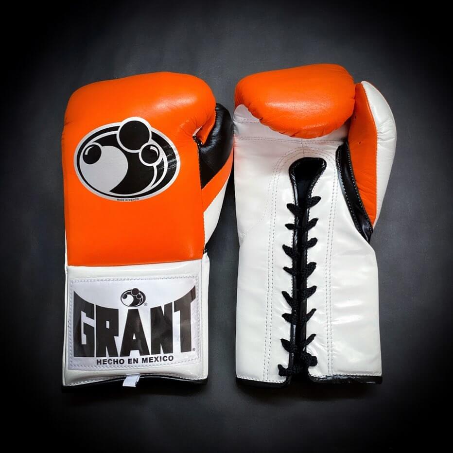 Grant Boxing Gloves in Orange/White/Black colorway - Professional Lace-Up training gloves