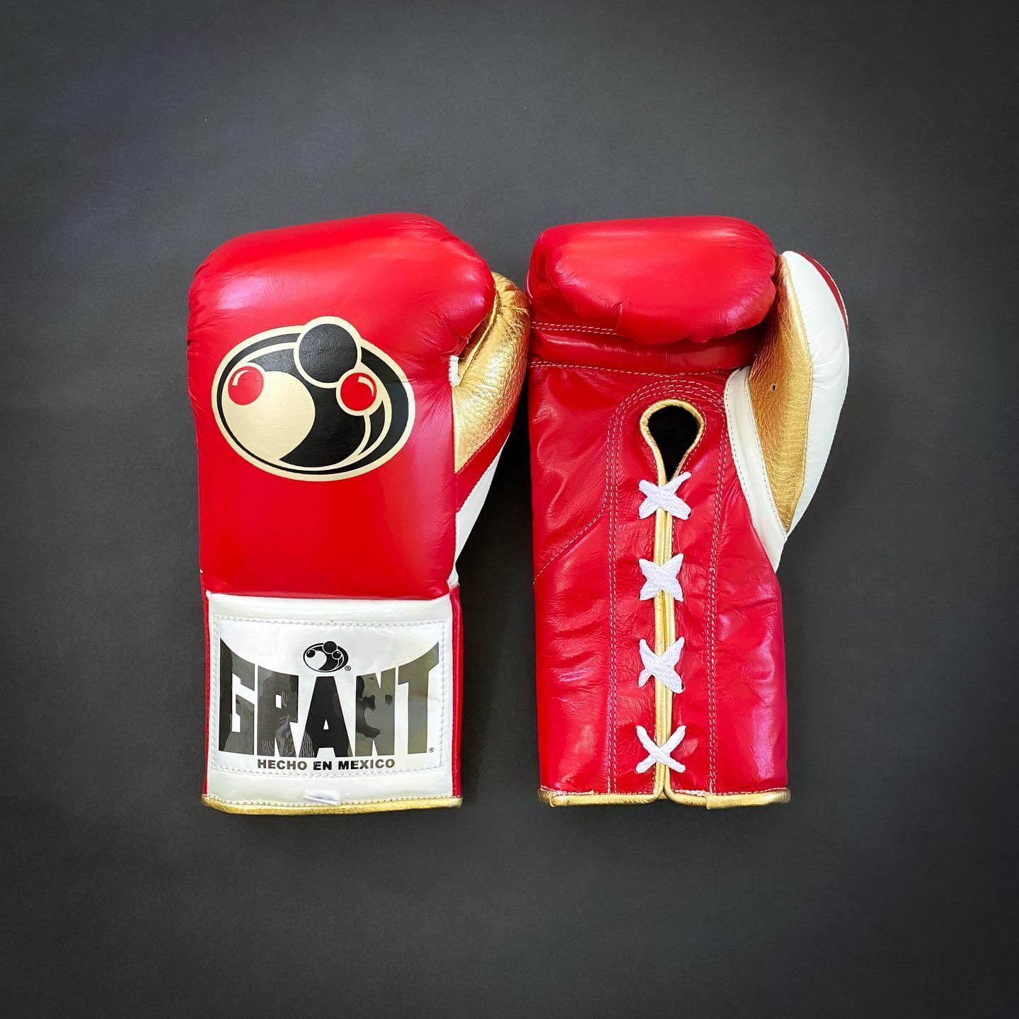 Grant Boxing Gloves in Red/White/Gold colorway - Professional Lace-Up training gloves