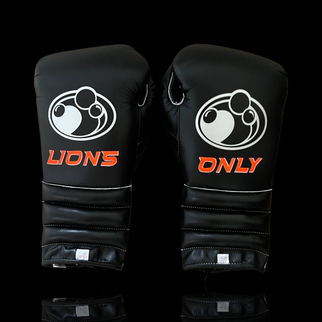 Grant Boxing Gloves in Black/Orange colorway - Professional Lace-Up training gloves